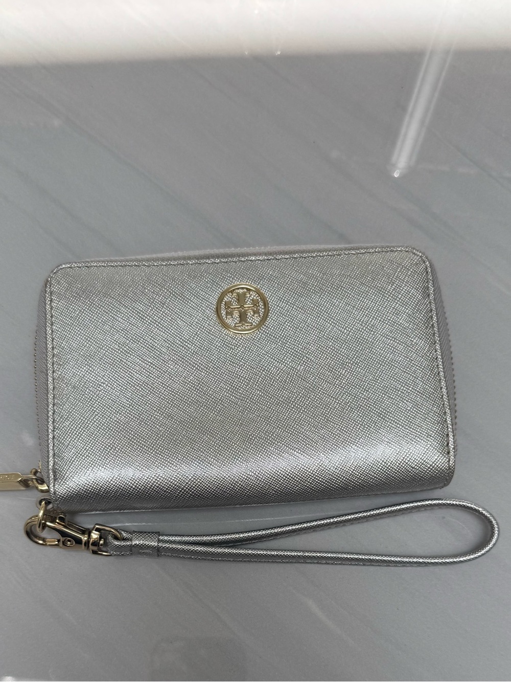 Tory Burch Metallic Silver Wristlet with Gold Logo